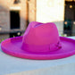 A picture of a hot pinl colored pencil rolled brim fedora hat.